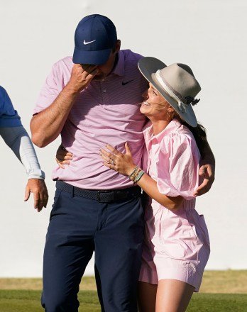 Scottie Scheffler, left, reacts as he gets a hug from his wife, Meredith, after winning the Dell Technologies Match Play Championship golf tournament, in Austin, Texas Match Play Golf, Austin, United States - 27 Mar 2022